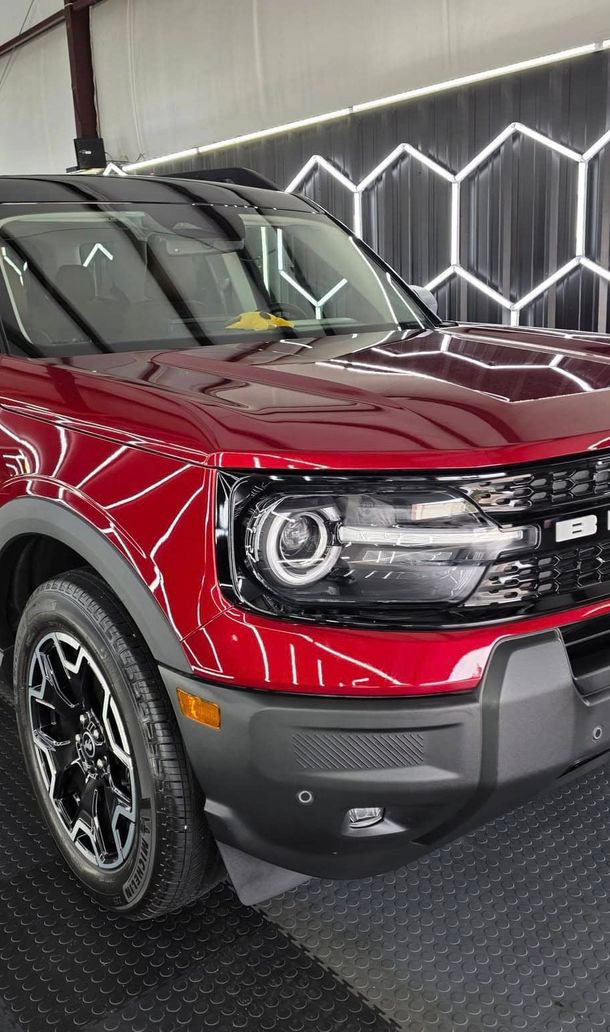 White Porsche going down windy road