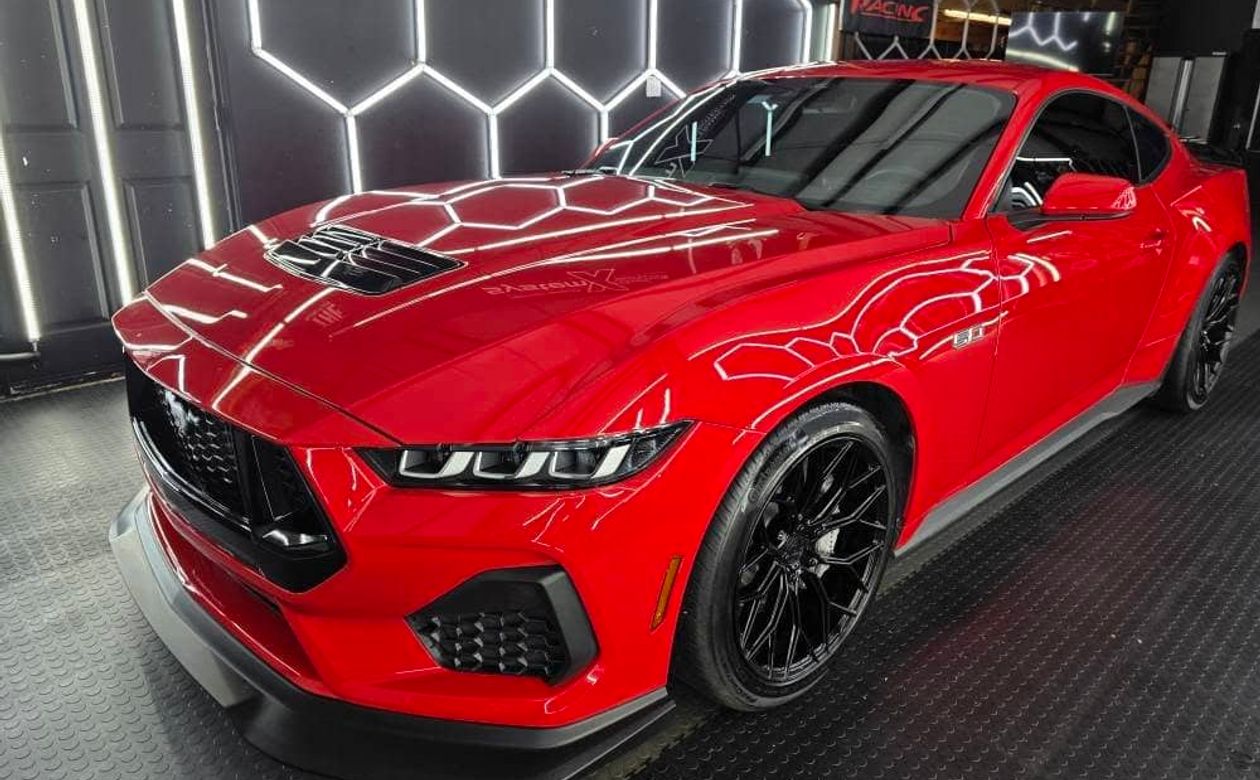 Shiny green Porsche on road